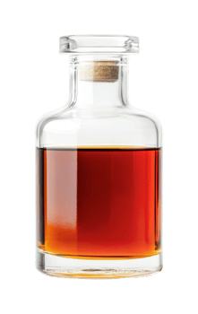 Clear glass bottle with pour spout filled with amber liquid, cut out png