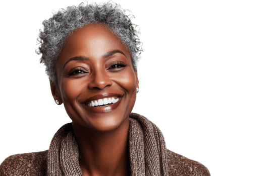 Smiling woman with curly gray hair wearing a cozy sweater png