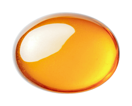 Transparent amber gel capsule with light reflection on black background png