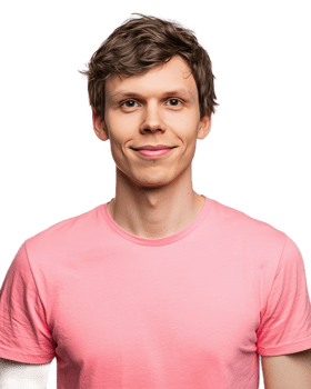 Confident young man in pink shirt smiling at with friendly expression png