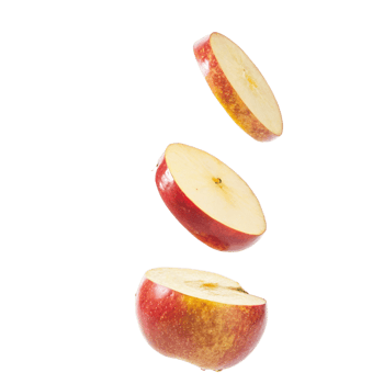 Three Slices of a Red Apple Falling Against a Black Background png