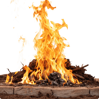 Fiery orange flames engulfing a bonfire built on a stone fire pit png