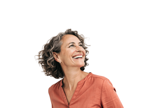 A confident middle-aged woman with curly hair, wearing an orange blouse, smiles warmly while looking upwards, radiating a sense of grace and joy png
