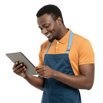 smiling man in apron using tablet, showcasing food, technology in modern setting png