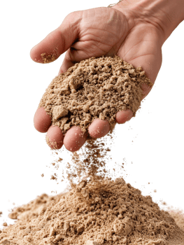 Hand Holding Fine Sand Above Pile of Sand Symbolizing Construction, Nature, and Earth Elements in Abstract Setting png