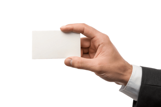 A man in a suit holds a blank white business card in his hand against a black background png