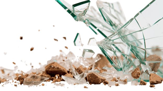 Broken glass scattering on ground with sharp shards and debris in a chaotic arrangement on a dark background png
