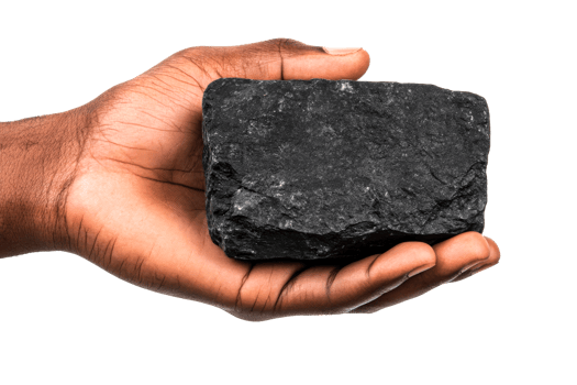 Hand holding a piece of coal against a transparent background png