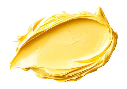 Golden butter spread on a clean surface in natural light png