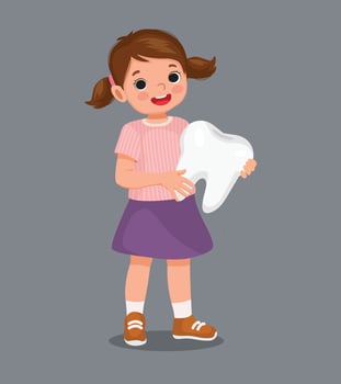 Cute little girl holding big tooth vector