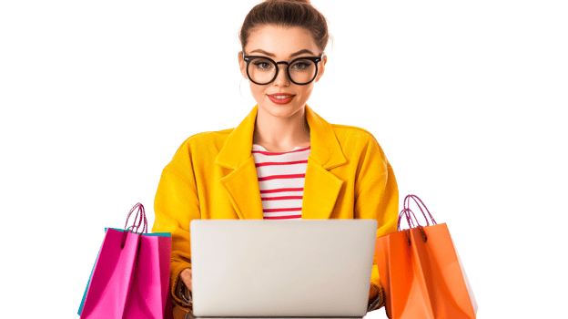 Fashionable woman with shopping bags using a laptop, cut out transparent png