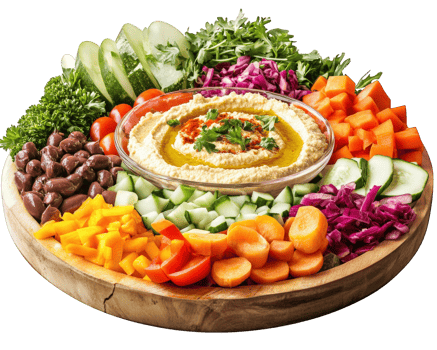 A plate with a variety of vegetables and hummus png