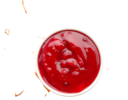 Close-up of a red sauce in a white bowl png
