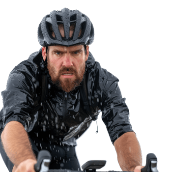 Intense Cyclist in Rain Gear Riding Through Wet Conditions with Focus and Determination png