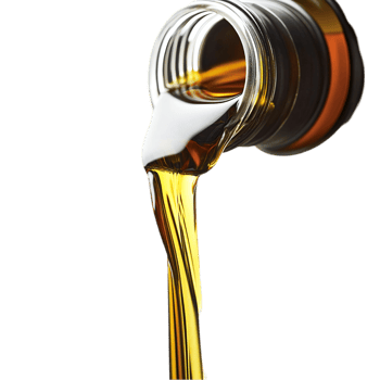 Pouring golden liquid from bottle on a plain background isolated on transparent background png