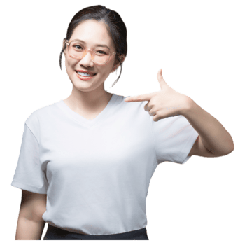 A smiling woman wearing a white shirt, pointing towards her side with a welcoming gesture. png