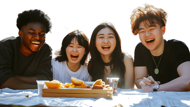 Laughing Friends Enjoying a Meal Outdoors png