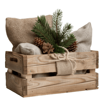 Rustic wooden crate filled with decorative pillows, evergreen foliage, and natural elements png