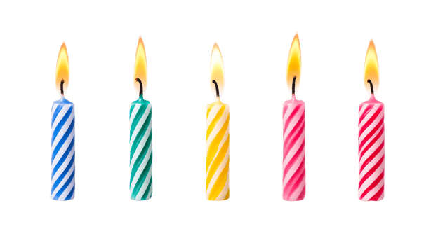 Striped candles stand in a row. Isolated bright candles , cut out transparent png