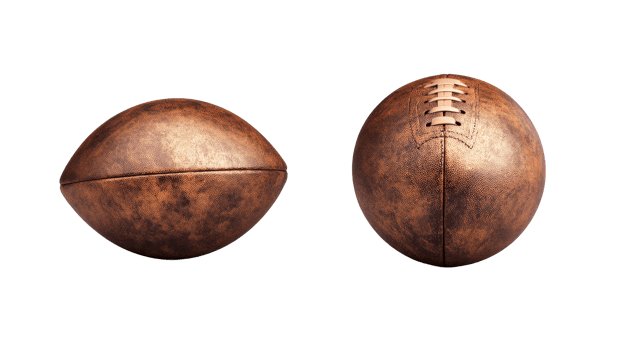 Two brown footballs on a black backdrop, cut out transparent png