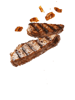 Delicious grilled steak with appetizing grill marks levitates against a stark background highlighting the juicy cut of meat png