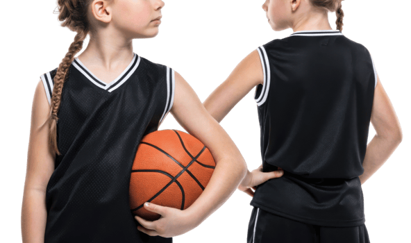 young athlete showcases basketball jersey mockup while confidently holding basketball, embodying spirit of game png