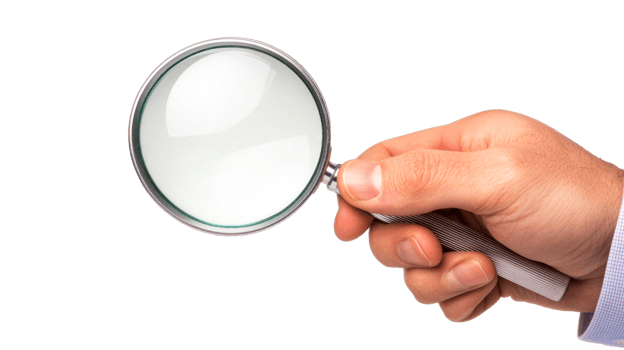 Hand holding magnifying glass up close, cut out transparent png