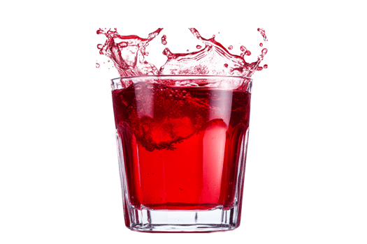 Red beverage bursts from a short clear glass on black, cut out transparent png