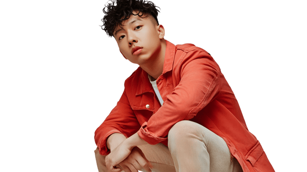 A person in a vibrant red shirt posing confidently against a black background ideal for fashio png