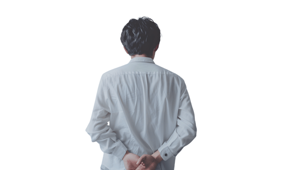 A person in a white shirt viewed from behind hands clasped isolated on black background for v png