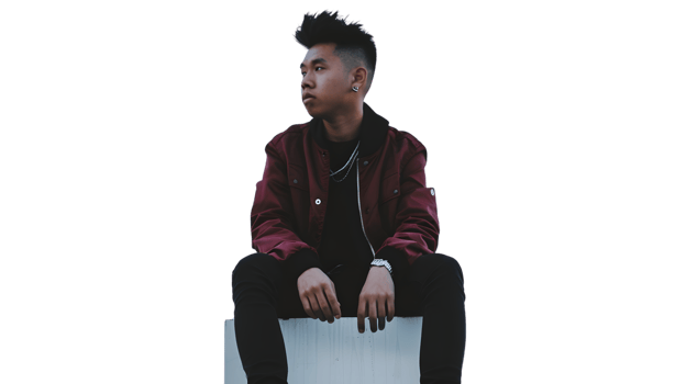A young individual in a stylish maroon jacket sitting confidently ideal for fashion lifestyle png