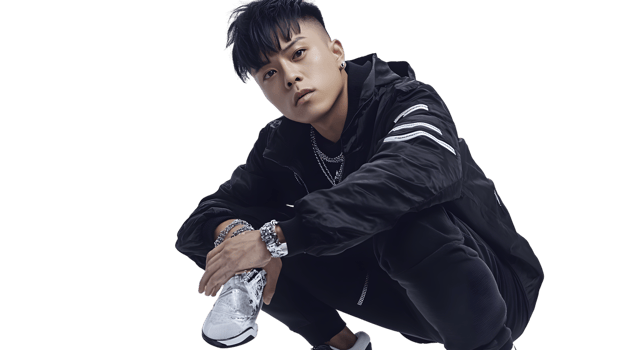 Dynamic Pose of a Stylish Individual in Urban Fashion with Accessories and Sneakers png
