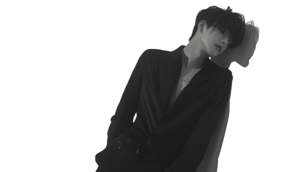 Elegant Pose in Monochrome A Person in a Suit Leaning on a Pillow with Closed Eyes png