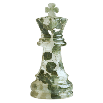 Green Glass King Chess Piece with Natural Leaves Embedded in Decorative Design png