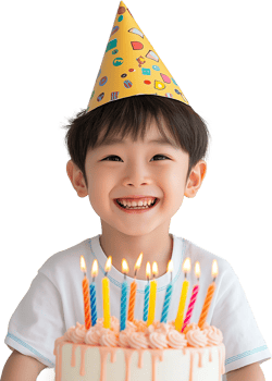 A boy wearing a party hat is sitting in front of a cake png