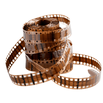 Vintage film reel with curling strips of film featuring abstract brown and black patterns png