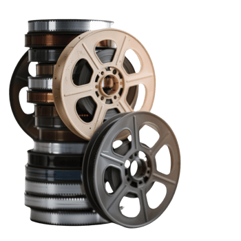 Vintage Film Reels Stacked on Each Other with Detailed Spools and Multi-Colored Tones png