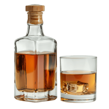 Elegant whiskey bottle with glass containing ice cubes on a white background png