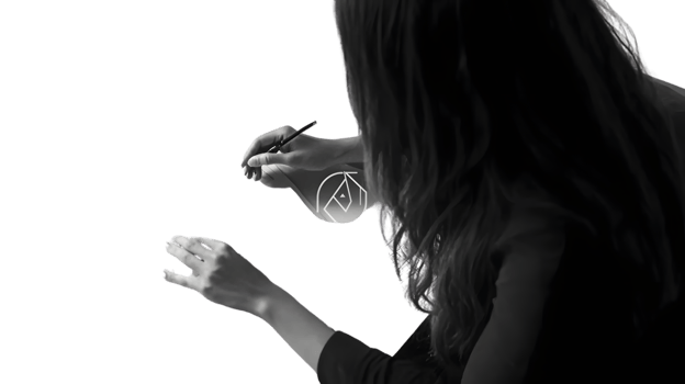 A person sketching a geometric design with a pen focusing on creativity and artistry png