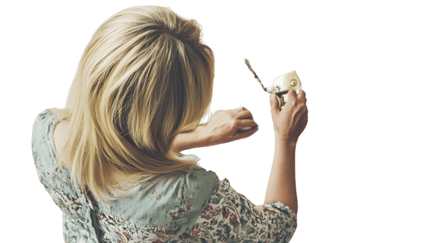 A person with blonde hair holding a vintage camera capturing memories from behind png