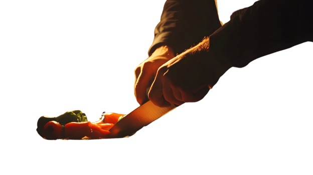 Culinary Precision Chefs Hands Slicing Fresh Vegetables with a Knife in Dramatic Lighting png