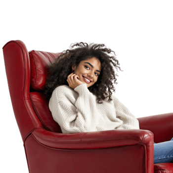 A woman sitting in a red leather recliner png