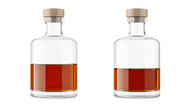 Two bottles of rum filled with brown liquid, isolated, cut out transparent png