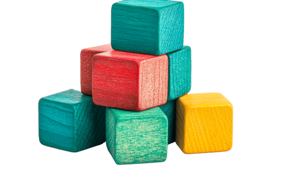 Colorful wooden cubes arranged in a tower, cut out transparent png