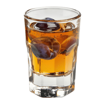A shot of liquor with blueberries in it png