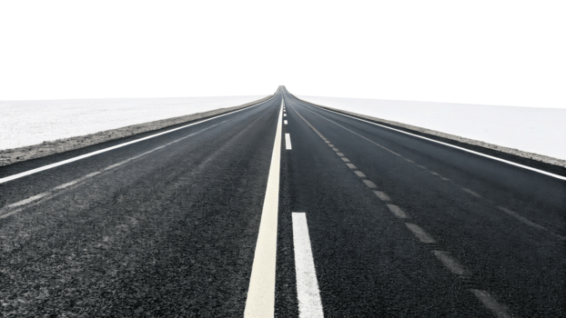 long, empty road stretches into distance, surrounded by white landscapes, evoking sense of freedom and adventure png