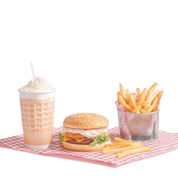 Delicious fast food meal with a crispy chicken burger, golden fries, and a creamy milkshake on a checkered tablecloth. png