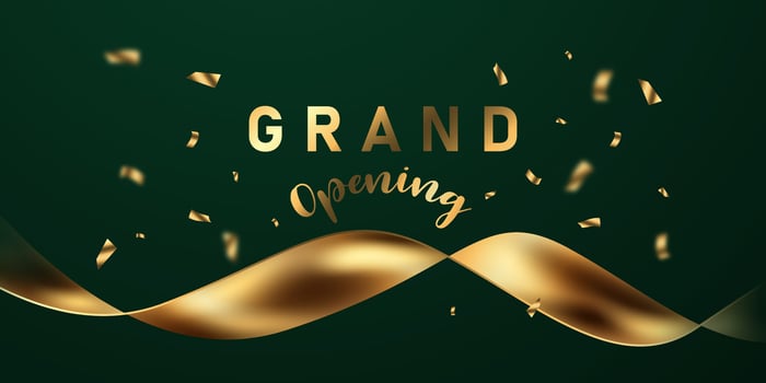 Golden ribbon with the word grand opening on a green background vector