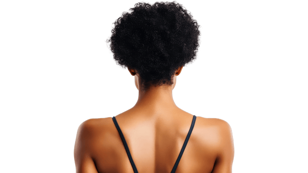 Back of a black woman with afro hair against black backdrop, cut out transparent png