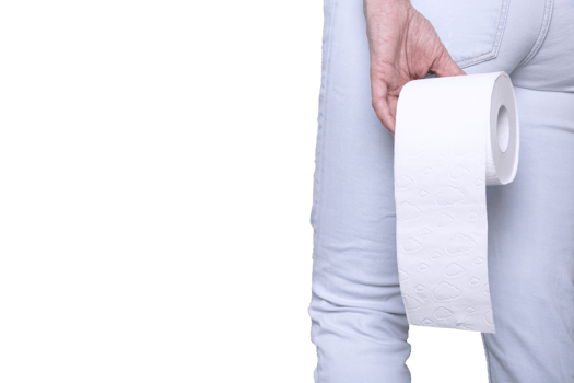 Young woman in toilet with roll of white toilet paper in hand. View from behind. Copy space. png